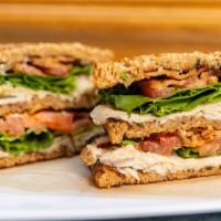 Turkey Club Sandwich · Roasted turkey, bacon, mayo, lettuce, tomato, and toasted 12-grain bread.