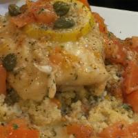 Herbs Stuffed Haddock · Tasty stuffed haddock with herbs & topped with A light lemon caper sauce over steamed cousco...