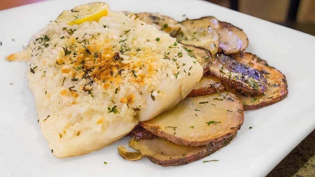 Baked Haddock · Flaky fish topped with breadcrumbs and a lemon Garlic sauce, served with roasted potatoes.