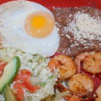 Chilaquiles Tapatios · The chunk of corn tortillas deep-fried mixed with green or red guajillo sauce, lettuce, toma...