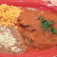 Chiles Rellenos · Poblano pepper stuffed with queso fresco, egg coating covered, homemade tomatoes sauce, rice...
