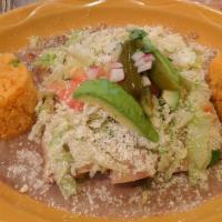 Enfrijoladas · Rolled soft corn tortillas dipped in beans sauce, filled with seasonal veggies or cheese, to...