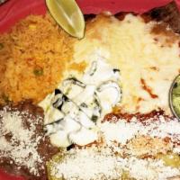 Tempiquena · Grilled chicken or steak covered with jack cheese, chipotle sauce, two chicken enchiladas, g...