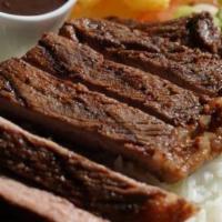 Sirloin Steak ( Picanha ) · Sirloin steak (picanha), rice, beans, fried yuca and salad, served with smoke sauce.