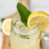 Mint Lemonade · Fresh squeezed lemon & lime, mint, ice, & touch of agave