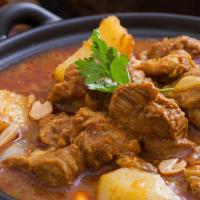 Massaman Curry · Containing potatoes, onion, peanut, tamarind, basil and your choice of protein.