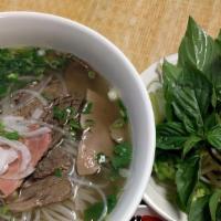Pho Combo · Pho with raw beef fillet, flank, meat balls, tendon, and tripe.