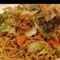 Yakisoba · Stir fried egg noodles prepared in sizzling wok served with Napa cabbage, carrot and green o...