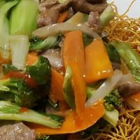 Bamee Rad Nar (Crispy Noodle) · Stir fried chow mein noodles prepared in sizzling wok served with broccoli, carrot, round on...
