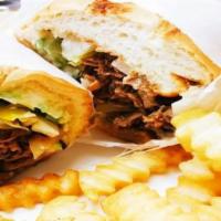 Steak & Cheese Sub · Rib eye steak and melted provolone cheese on a toasted sub roll.