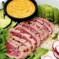 Spicy Tuna Bowl · seared ahi tuna, cilantro rice, avocado, arugula, sprouts, radish, sesame seeds, chipotle dr...