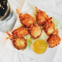 Coconut Shrimp · Served with an orange pineapple marmalade dipping sauce.