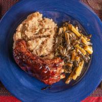 Pork Ribs With Mashed Potatoes · A cut of meat including the rib.
