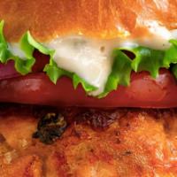 Salmon Burger · Preserved lemon-caper aioli, lettuce, tomato pickled cauliflower salad