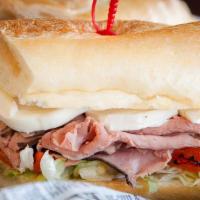 Italian Roast Beef Sandwich · Roast Beef, Fresh Mozzarella, Roasted Peppers, Mayo, and Lettuce on a Grilled 8