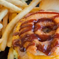 Western Bbq Burger · Made with 1/3 Pound Angus Beef Patties, Cheddar Cheese, Onion Rings, and BBQ Sauce with Lett...