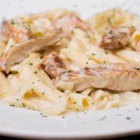 Alfredo · Topped with your choice of chicken, shrimp, or both.