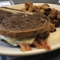 Easter'S Egg Mac · 2 eggs, choice of bacon, ham or sausage and cheese on toasted English muffin served with hom...