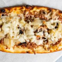 Rustic Flatbread · Fresh mushrooms, sweet sausage, caramelized onions, and mozzarella cheese.