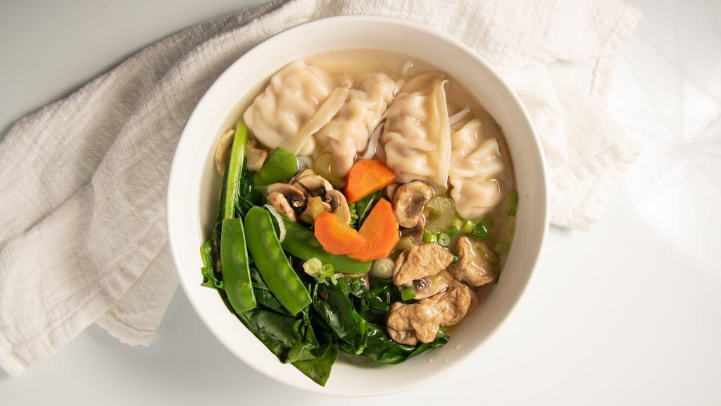 Vegetarin Pho · Vegetable dumplings, fried tofu, fresh mushrooms, snow peas, napa cabbage, thin rice noodles and vegetarian soup.