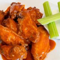 Chicken Wings · 8 Jumbo wings tossed in your choice of sauce.