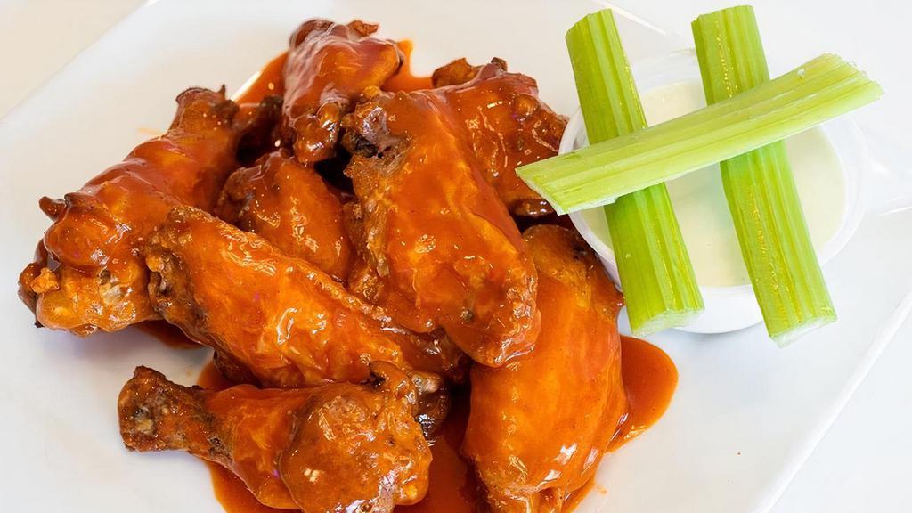 Chicken Wings · 8 Jumbo wings tossed in your choice of sauce.