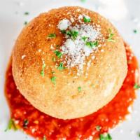 Arancini · Nonna's Arancini Recipe. Fried Risotto Ball Stuffed with Meat Sauce and Sweet Peas.
