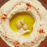 Hummus · Authentic hummus takes time. We soak protein-packed dry chickpeas for 12 hours before mixing...