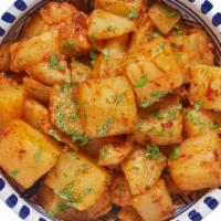 Spicy Potatoes · Cooked with garlic and cilantro, our hand-cut spicy potatoes add just the right kick to any ...