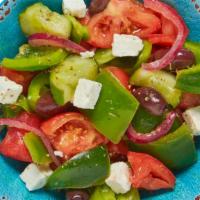Greek Salad · Our authentic Greek salad is filled with fresh juicy tomatoes, crunchy green peppers, and ta...