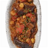 Moussaka · Slow-cooked eggplant, tomatoes, garlic, onions, chickpeas, olive oil, and spices make this c...
