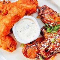 Wings · Choice of buffalo, BBQ, G'Tso, celery, carrots with ranch or blue cheese.