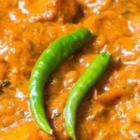 Paneer Butter Masala · Paneer cooked with creamy tomato sauce, butter, onion, bell peppers.