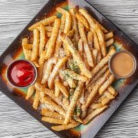Truffle Fries · Parmesan fries with truffle oil served with chipotle mayo and ketchup.