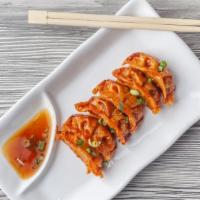 Gyoza · Fried  pork dumplings served with a sweet ginger soy sauce.