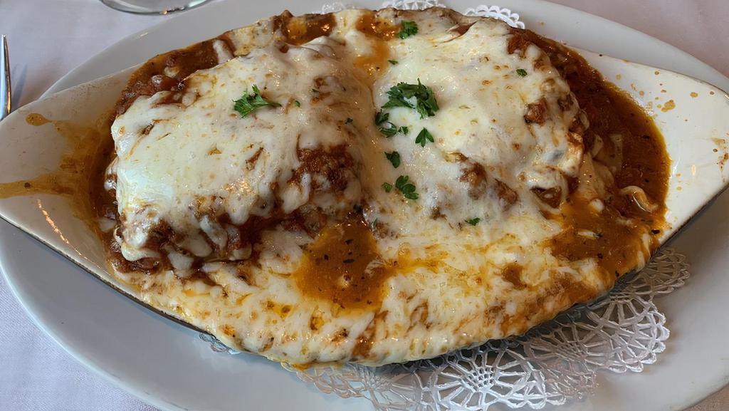 Lasagna · Oven baked layers of pasta, meat sauce, ricotta, mozzarella, provolone & parmesan cheeses topped & finished with melted cheese.
Add meatball, italian sausage or mushrooms with an additional charge.