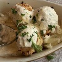 Seafood Stuffed Mushrooms · Mushroom caps stuffed with shrim, crap and labster meat, topped with lemon- dill cream sauce.