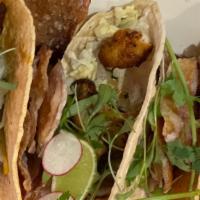 Twisted Fish Tacos · blackened cod, mushy peas, vinegar slaw, chips