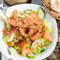 Fattosh Salad · Lettuce, cucumber, tomato, green pepper, onions, parsley, sumac, lemon olives oil and toaste...