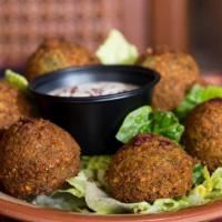 Falafel · Made with chickpeas, fava beans, onions, cumin and parsley. Served with tahini sauce.