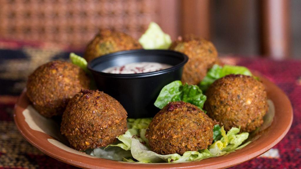 Falafel · Made with chickpeas, fava beans, onions, cumin and parsley. Served with tahini sauce.