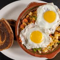 Portuguese Skillet · Home fries topped chourico, onions, peppers, topped with Cheddar cheese, two eggs any style,...