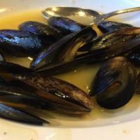 Mussels · Tender, steamed, domestic black mussels in a white or red sauce.