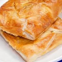 Penovani Khachapuri · Oven baked dough, filled with sulguni and imeruli cheese melted inside puff pastry.