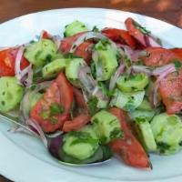 Georgian Salad  · Gluten-free, vegan. Fresh tomatoes, cucumbers, fresh herbs, vinegar.
