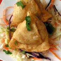 Savage Samosa (2 Pcs) · Filo pastry turnovers filled with a gently spiced potato, peas, and dry spice mix and fried ...