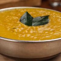 Light Yellow Dal  · Slow-cooked lentil, tempered with tomatoes, onions, green chilis, and Indian spices. Served ...