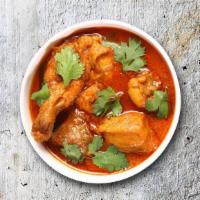 Capital Chicken Curry · Bone in/ boneless chicken pieces simmered in a brown onion and tomato curry, seasoned with f...