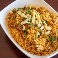 Vegetable Biryani · basmati rice cooked with vegetables, spices and nuts.