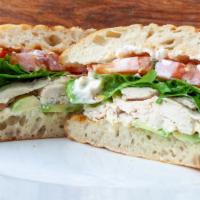 Roast Chicken Sandwich · Roasted chicken, lettuce, avocado, pickles, tomato, focaccia bread and mayo.